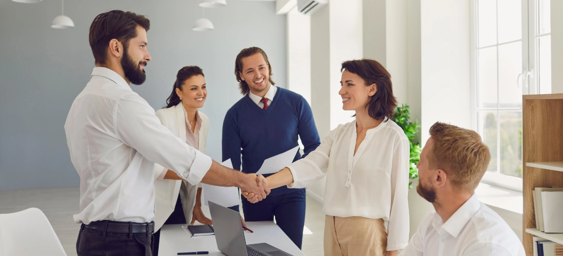 Happy people in a business meeting, shaking hands