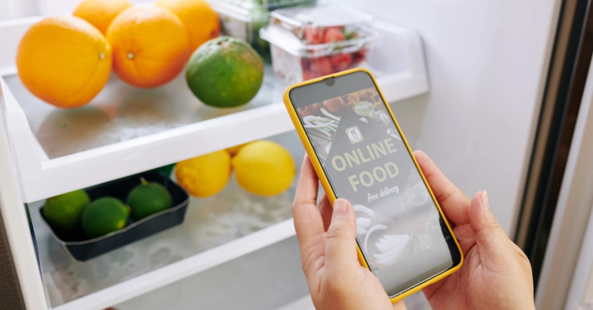 Smartphone screen displaying an app for online grocery shopping and food delivery