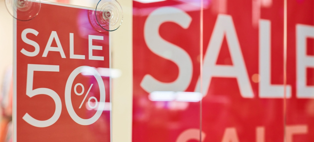 A red sale sign in a shop
